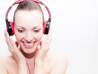 Fototapeta premium Young happy woman listening to music. 