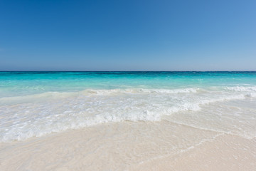 Obraz premium Beautiful beach and tropical sea, Wave of the sea on the sand beach