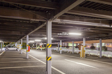 Empty outdoor car parkig space at night time