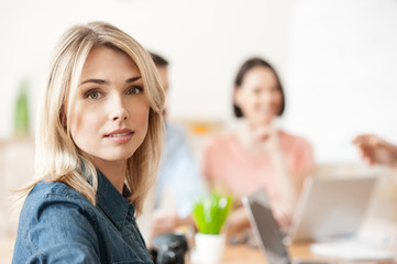 Attractive lady is working with her team