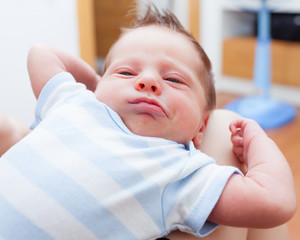 Cute baby boy waking up from a nap. 