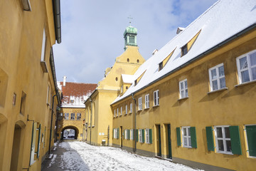 Small street in the Fuggerei district in Augsburg, Germany