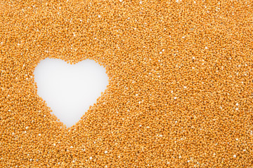 Millet cereal grains with heart - health concept