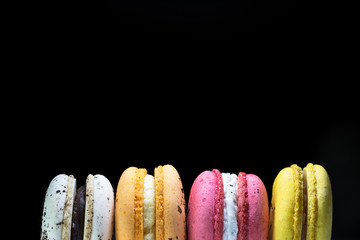 Close up of french colorful macarons isolated on white background