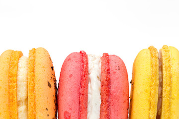 Close up of french colorful macarons isolated on white background
