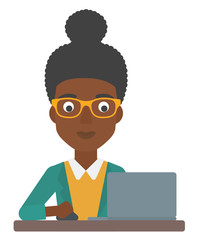 Woman working at laptop.