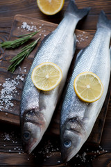 Close-up of fresh uncooked seabass fish, selective focus