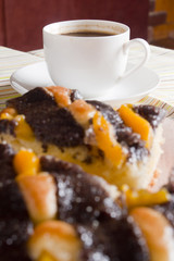 Coffee and cake with poppy seeds and orange