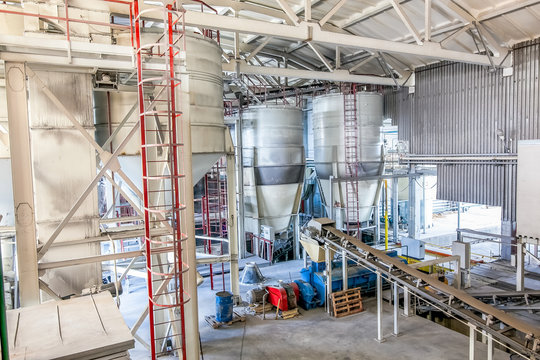 production facilities with automated machinery at factory producing blocks