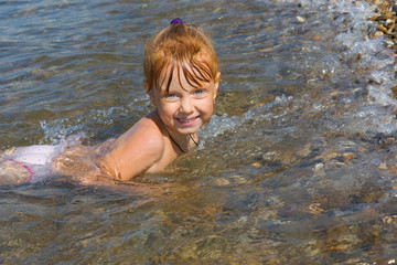 Happy red-haired child of the sea