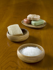 Fototapeta na wymiar spa herbal salt, soap and loofah