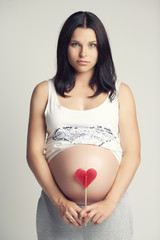 Pregnant brunette woman.