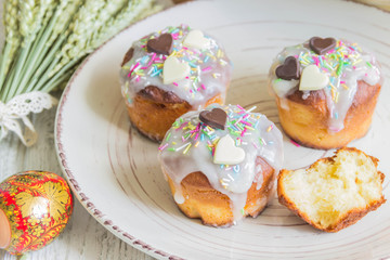 Traditional Easter cake with glace icing and painted easter eggs.Rustic style. Easter arrangement