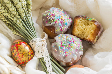 Traditional Easter cake with glace icing and painted easter eggs.Rustic style. Easter arrangement
