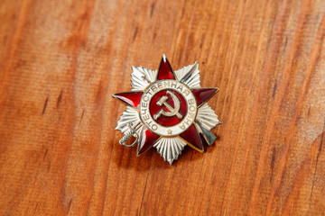 Order of the Patriotic War in St. on a wooden background