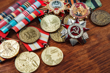 Order of the Patriotic War in St. and Medals for the victory over Germany on a table. close up....
