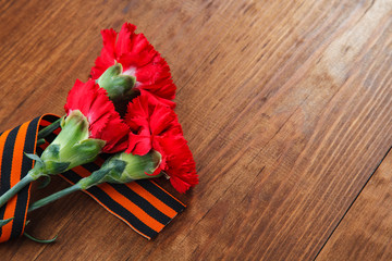 Symbols of Victory in Great Patriotic War 1941-1945 on wooden table