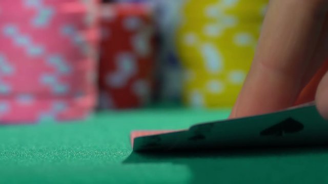Person having bad combination in poker, weak hand. Losing money, bankruptcy