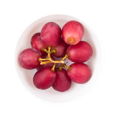 Red grapes, berries in a bowl on a