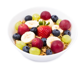 Muesli, fruit, berries in a bowl on a