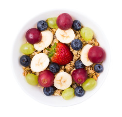 Naklejka na ściany i meble Muesli, fruit, berries in a bowl on a