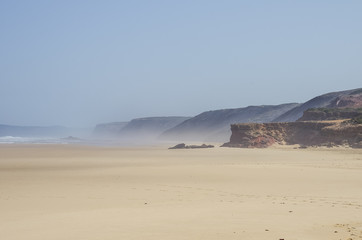 A view of beautiful Bordeira beach, famous surfing place in Algarve region, Portugal