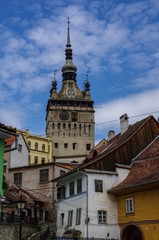 Obraz premium Clock tower and old houses of medieval town of Sighisoara, Transylvania, Romania
