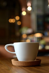 cup of espresso coffee with blur cafe shop background