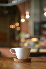 cup of espresso coffee with blur cafe shop background