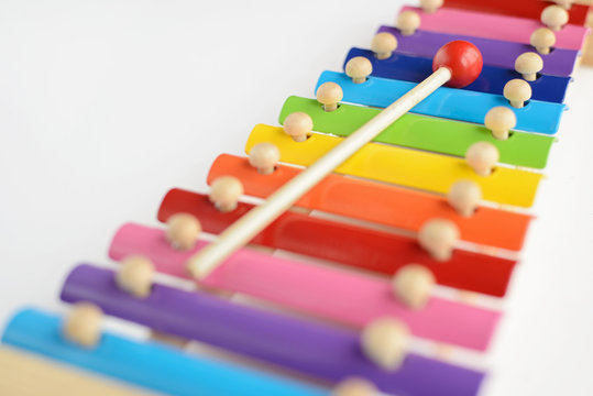 Colorful baby xylophone with stick isolated over white backgroun