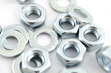 Several metal screw washers and nuts