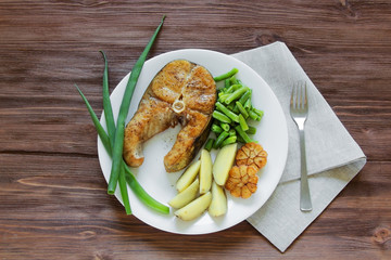 fried fish with potatoes and asparagus