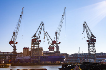 Fototapeta na wymiar Harbor cranes in sea port of Helsinki, Finland. 