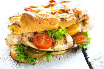 Delicious sandwich with grilled chicken and fresh crunchy vegetables 