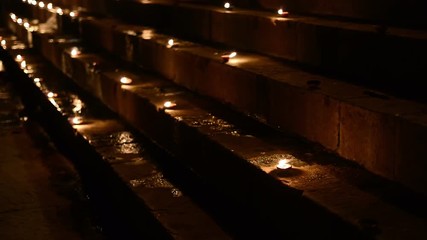 Ceremonial candles burning on the ghat in Varanasi India, shallow depth of view.