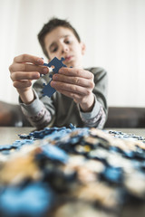 Child and puzzle.