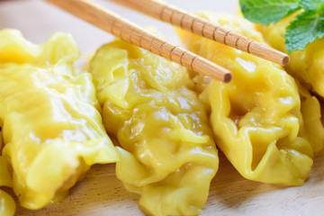  fresh dumpling on plate with hot steams.