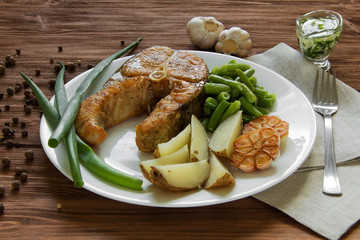 fried fish with potatoes and asparagus