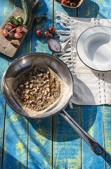 Salad with tomatoes, cucumber, onion and caramelized nuts.