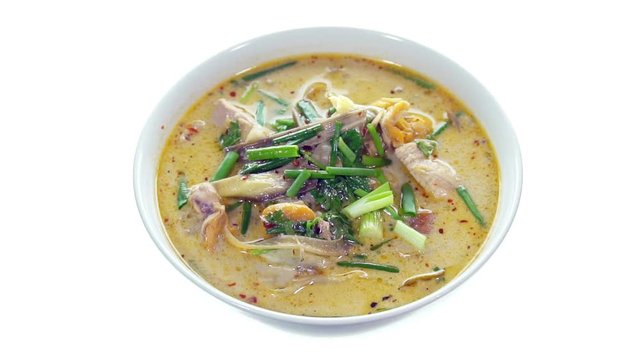 Sliced Green Onion Fall On Coconut soup with chicken, Slow motion
