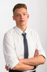 portrait of young stylish businessman on gray background