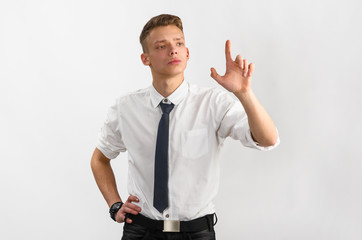 portrait of young stylish businessman on gray background
