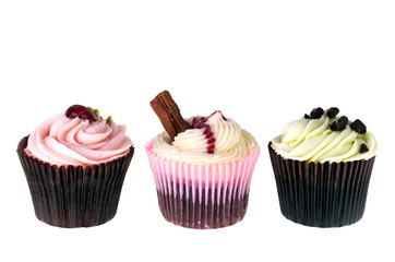 Three cupcakes isolated over white background