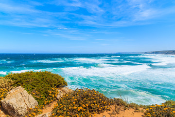 Fototapeta na wymiar Ocean waves on Praia do Bordeira beach, Algarve region, Portugal