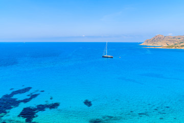 Fototapeta na wymiar A yacht boat on in Ostriconi sea bay, Corsica island, France