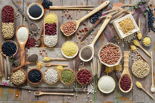 Top view of various leguminous with a wooden cookware, Flat lay