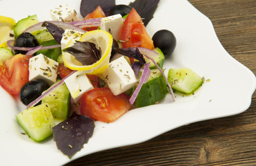 Greek salad in the white plate