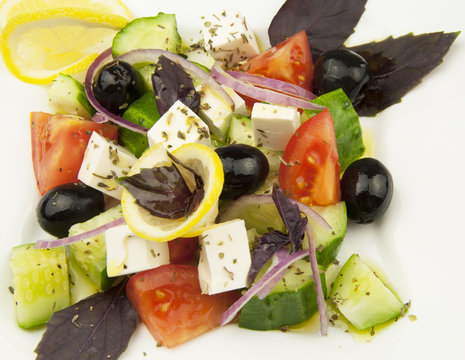 Greek salad in the white plate