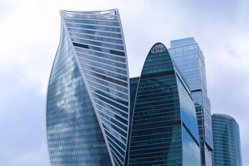 Fototapeta na wymiar Blue skyscrapers heads in business centre