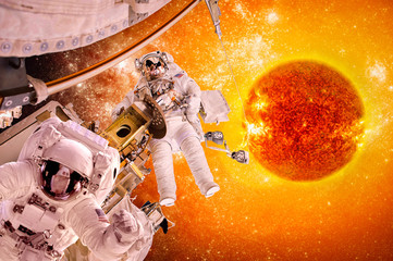 Spacecraft and astronauts in space on background sun star